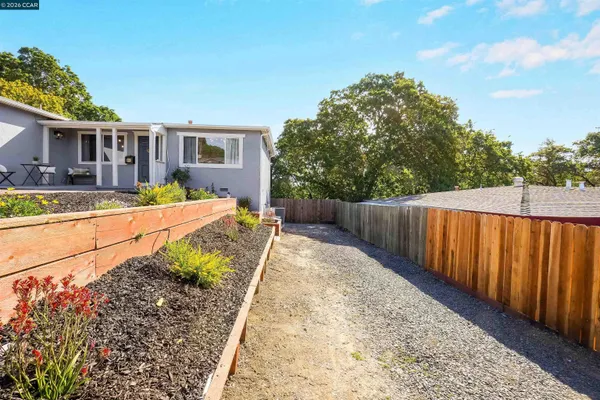 a kitchen with stainless steel appliances granite countertop a stove a sink dishwasher a refrigerator and a microwave