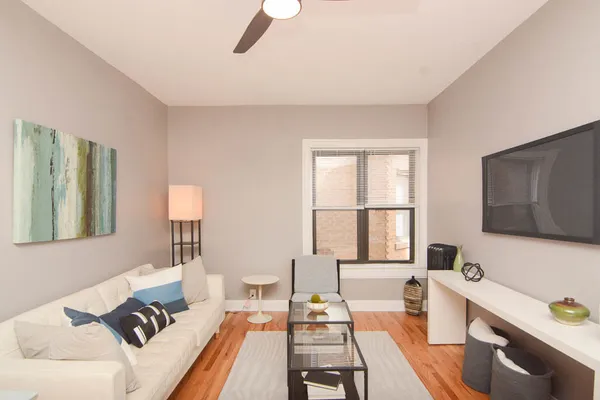 a living room with furniture and a window