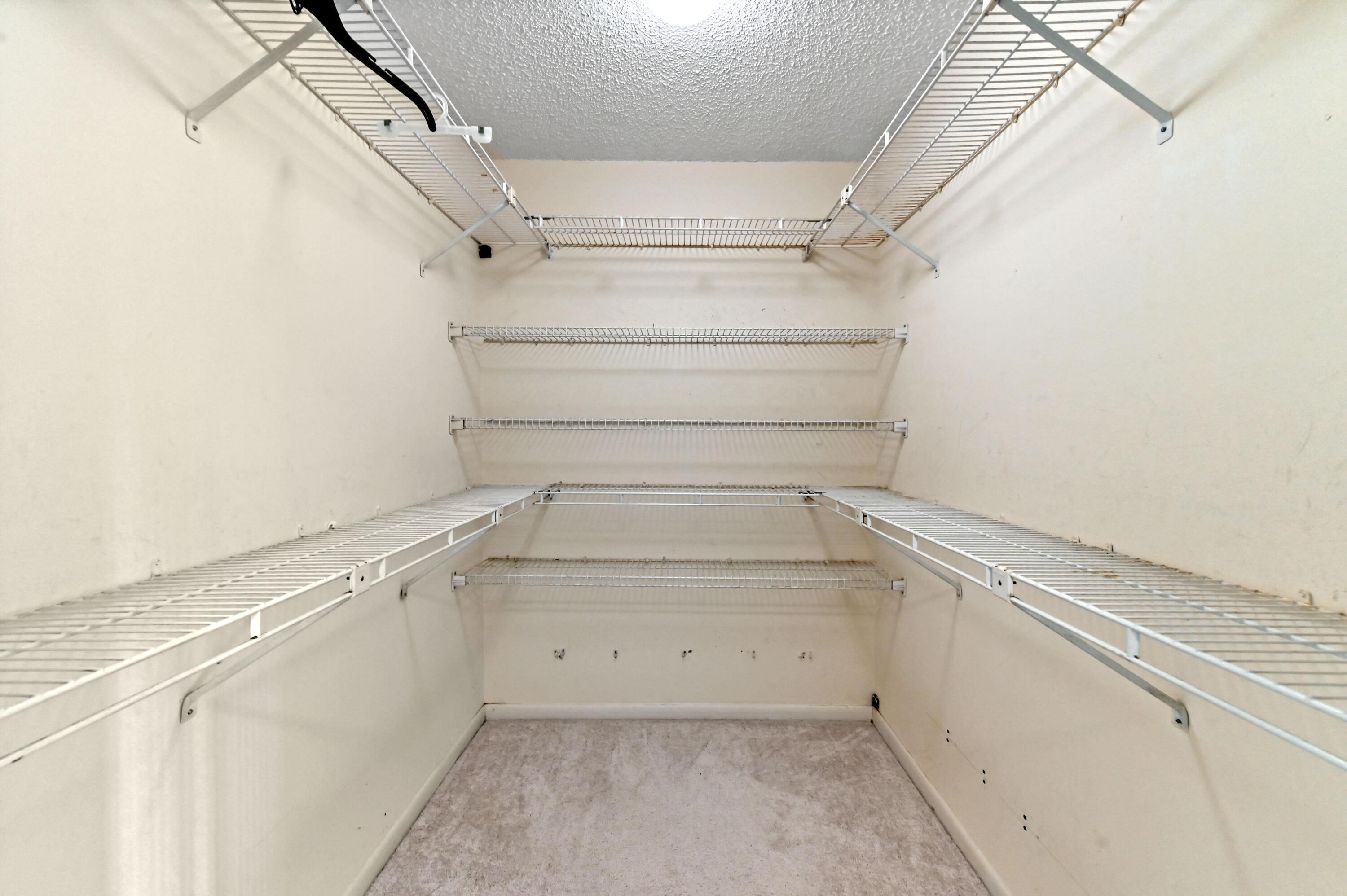 33 Southport Lane, Unit D Boynton Beach, FL 33436 - Photo 20 of 42 a view of a storage & utility room with racks on the wall