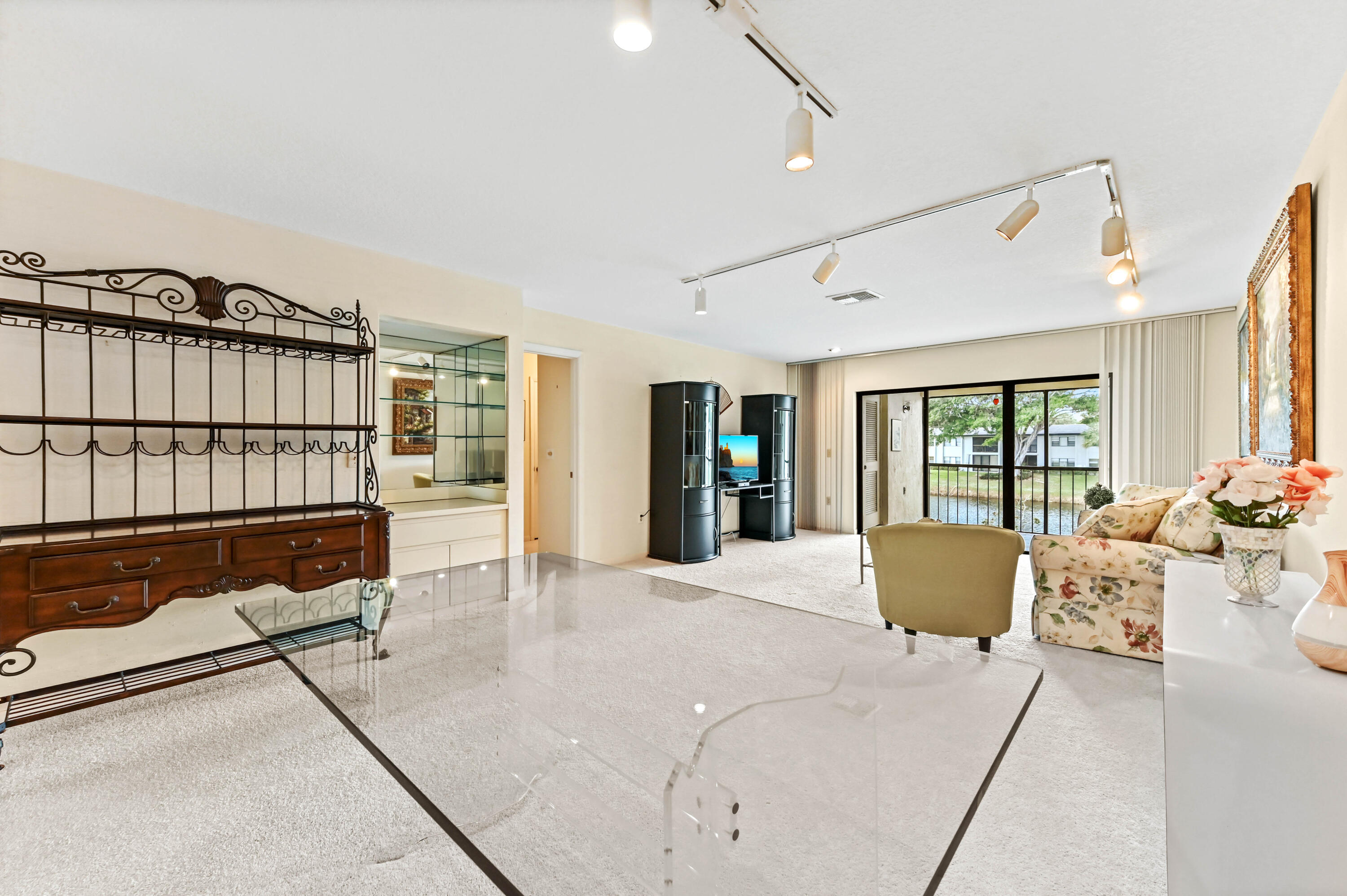 33 Southport Lane, Unit D Boynton Beach, FL 33436 - Photo 25 of 42 a bedroom with furniture and large window