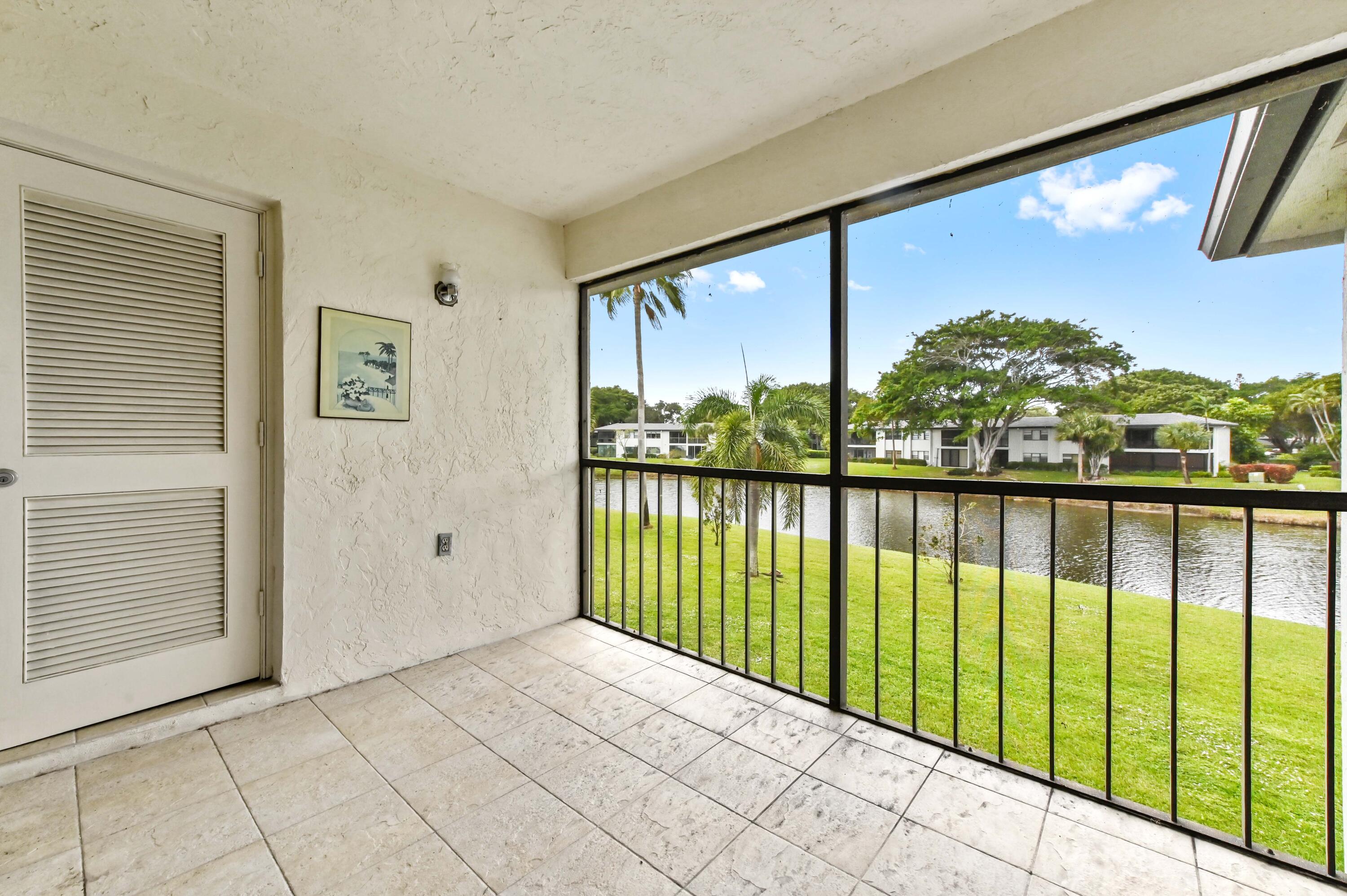 33 Southport Lane, Unit D Boynton Beach, FL 33436 - Photo 32 of 42 a view of a porch