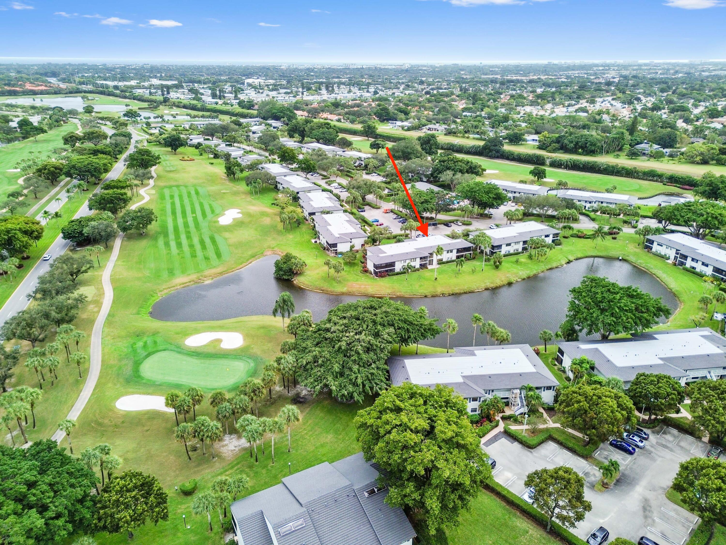 33 Southport Lane, Unit D Boynton Beach, FL 33436 - Photo 38 of 42 an aerial view of a houses with a yard