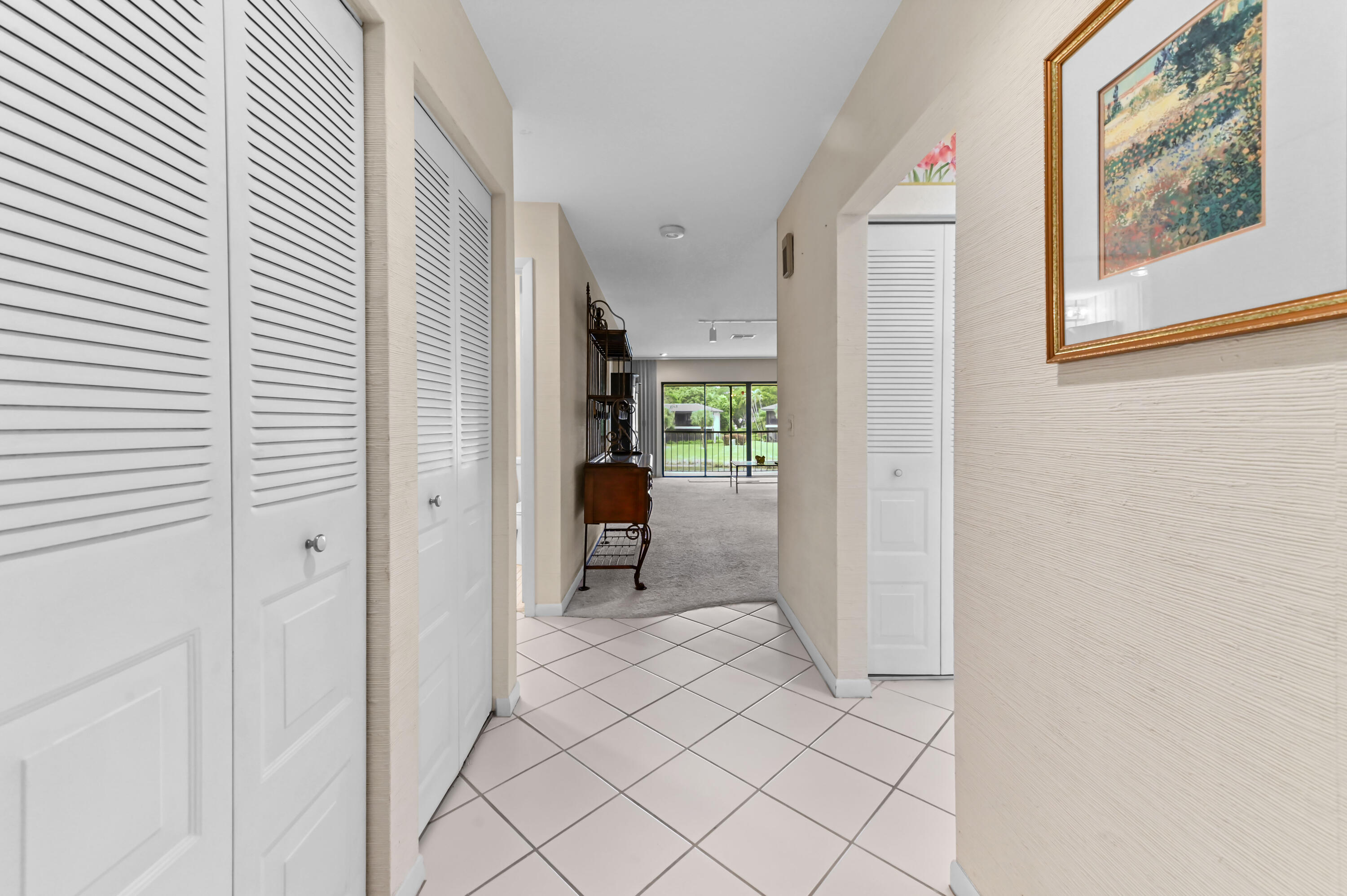 33 Southport Lane, Unit D Boynton Beach, FL 33436 - Photo 4 of 42 a view of an entryway with wooden door