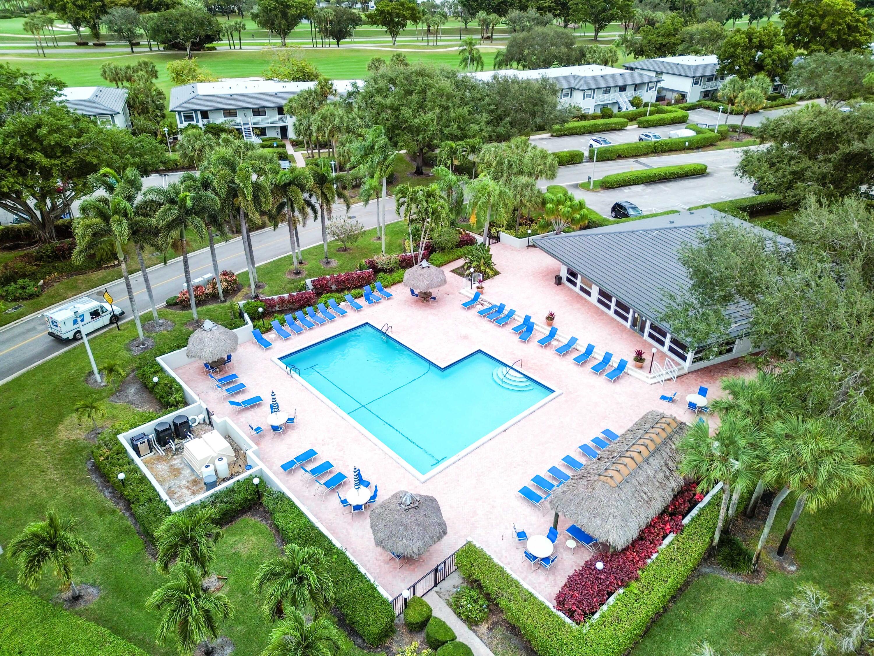 33 Southport Lane, Unit D Boynton Beach, FL 33436 - Photo 42 of 42 a view of an outdoor space yard pool patio and outdoor seating