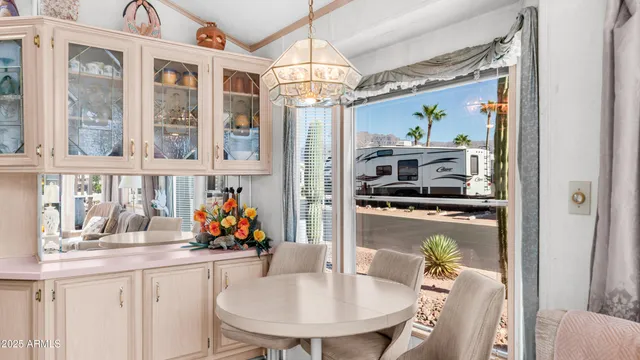 a kitchen with stainless steel appliances granite countertop a sink a stove and cabinets