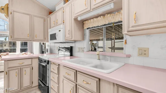 a bedroom with a bed flat screen tv and a window