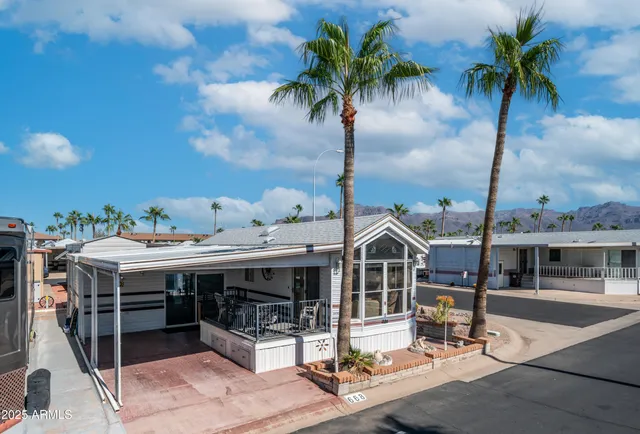 a view of a patio with iron fence