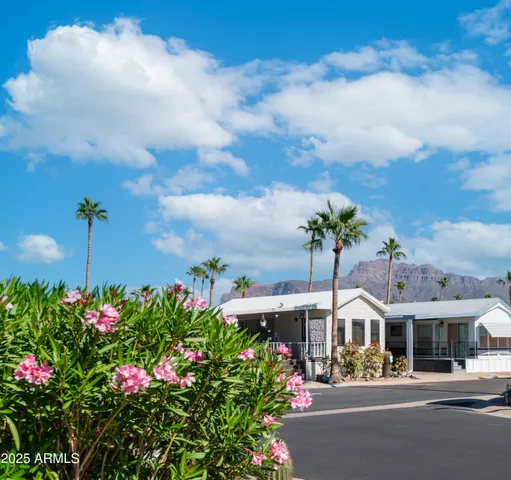 a front view of a building with outdoor seating