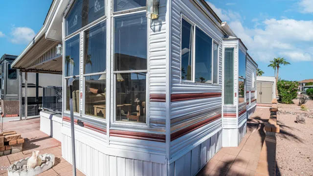 a view of a chairs and table in the balcony