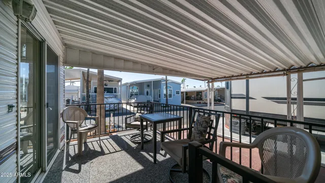 a dining room with furniture a chandelier and a rug