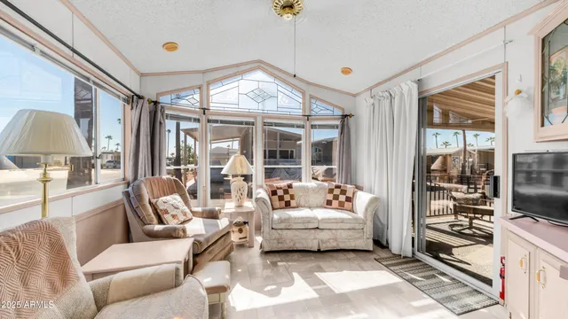a kitchen with a refrigerator sink and white cabinets