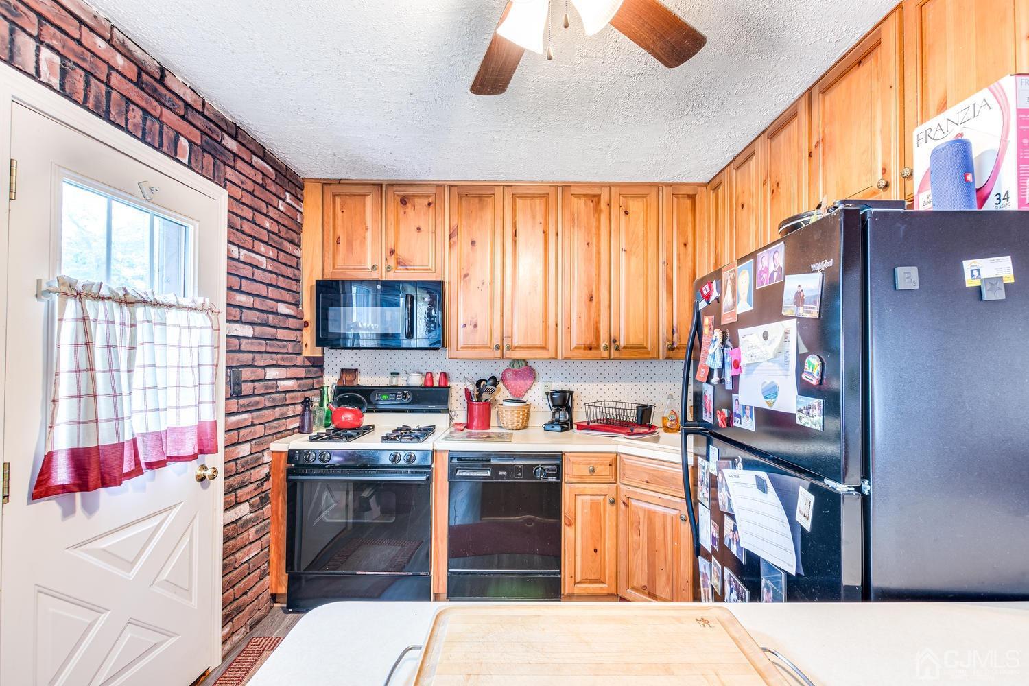 20 Parkerson Road Edison, NJ 08817 - Photo 14 of 26 a kitchen filled a counter top space a sink a window and stainless steel appliances