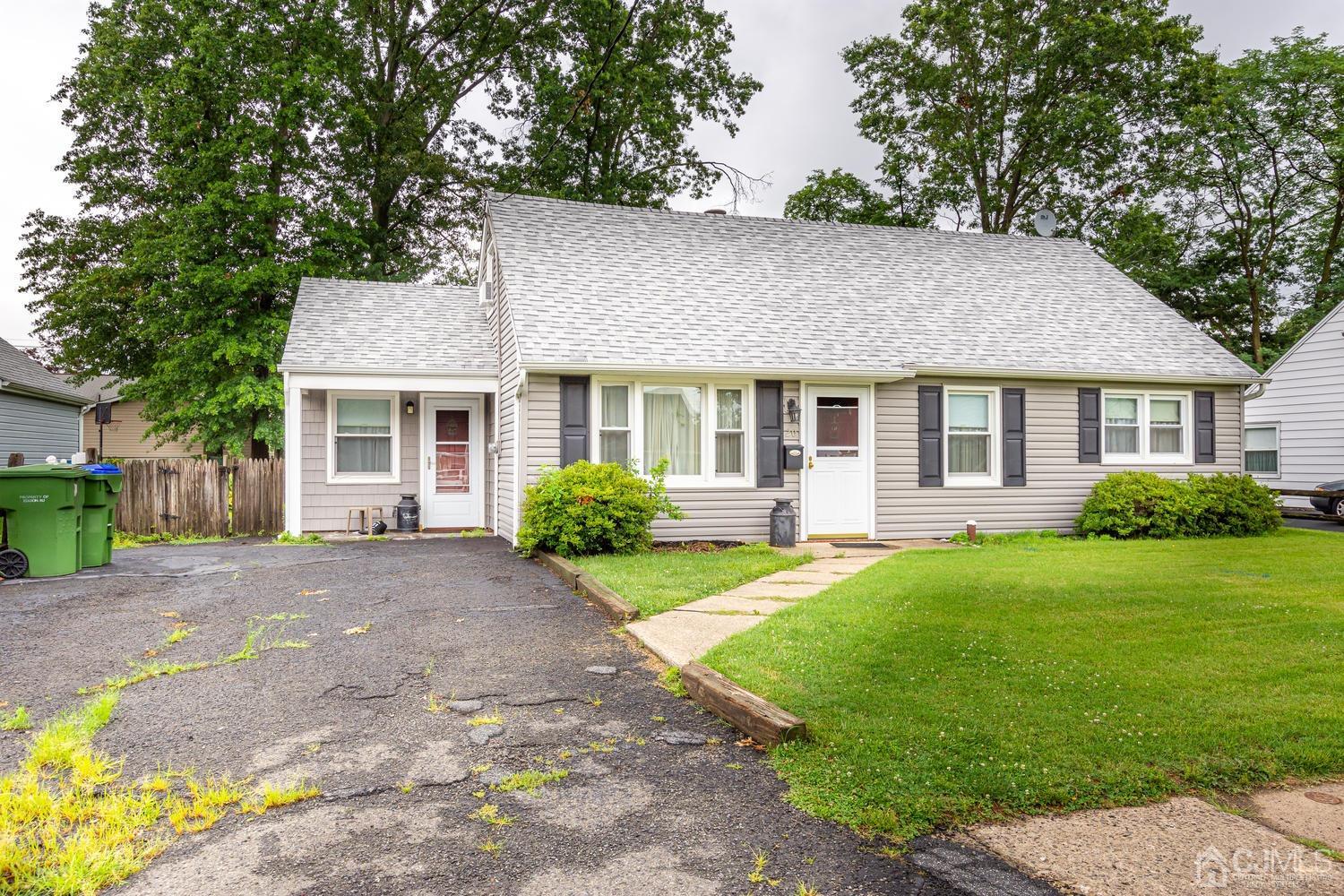 20 Parkerson Road Edison, NJ 08817 - Photo 3 of 26 a front view of a house with yard and green space