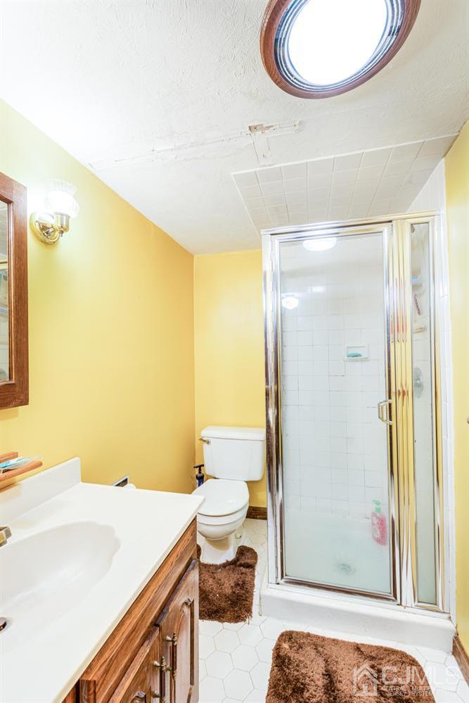 20 Parkerson Road Edison, NJ 08817 - Photo 22 of 26 a bathroom with a sink and a mirror