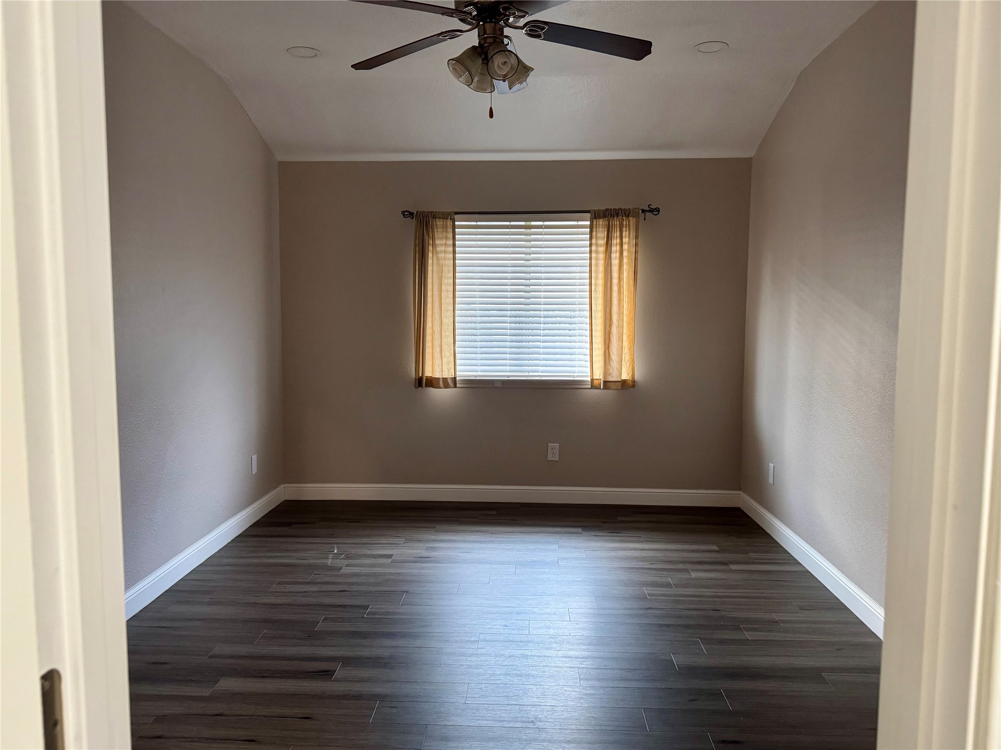 9431 Water Edge Point Lane Humble, TX 77396 - Photo 11 of 16 a view of an empty room window and wooden floor