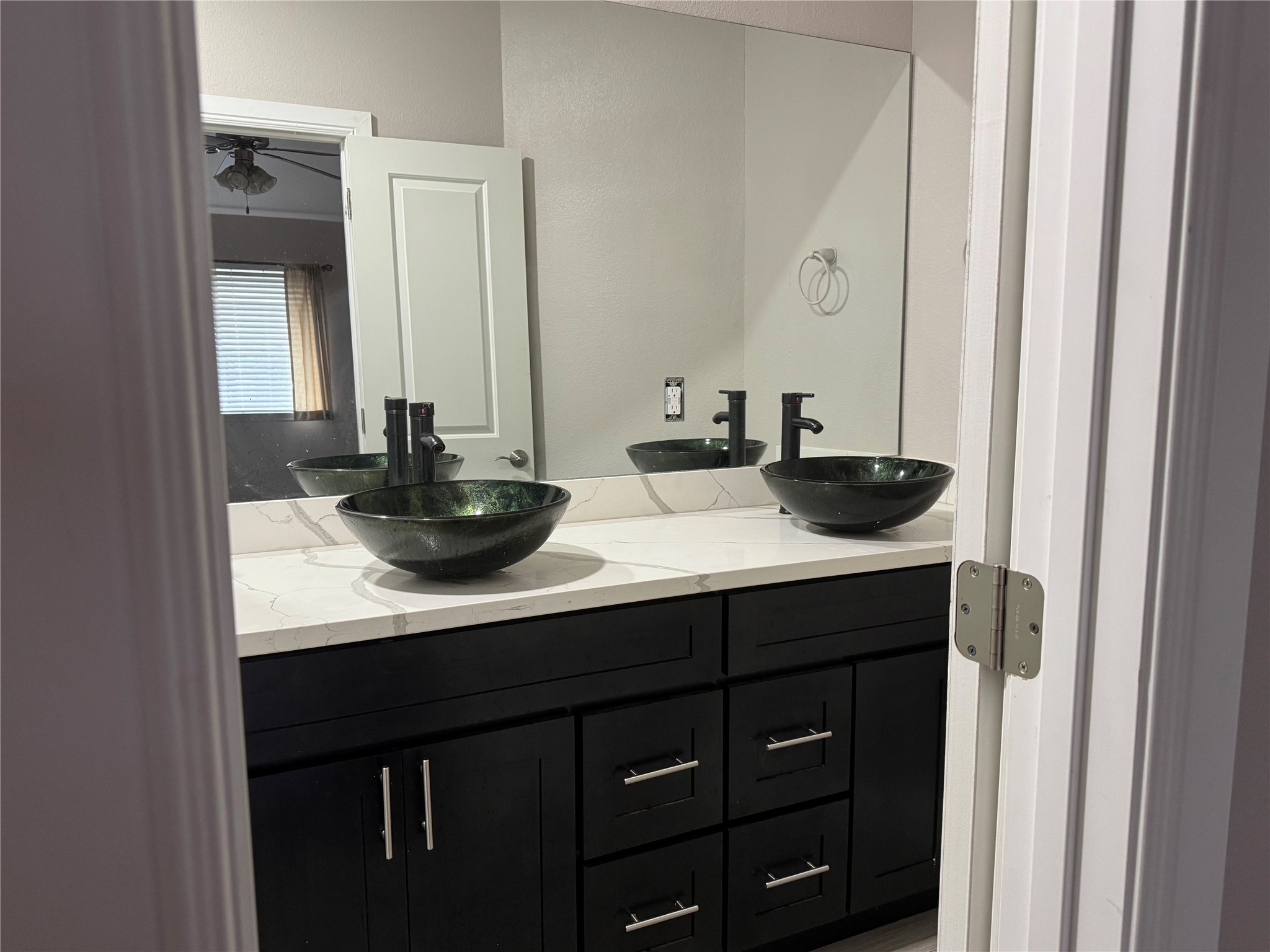 9431 Water Edge Point Lane Humble, TX 77396 - Photo 14 of 16 a bathroom with a sink and a mirror
