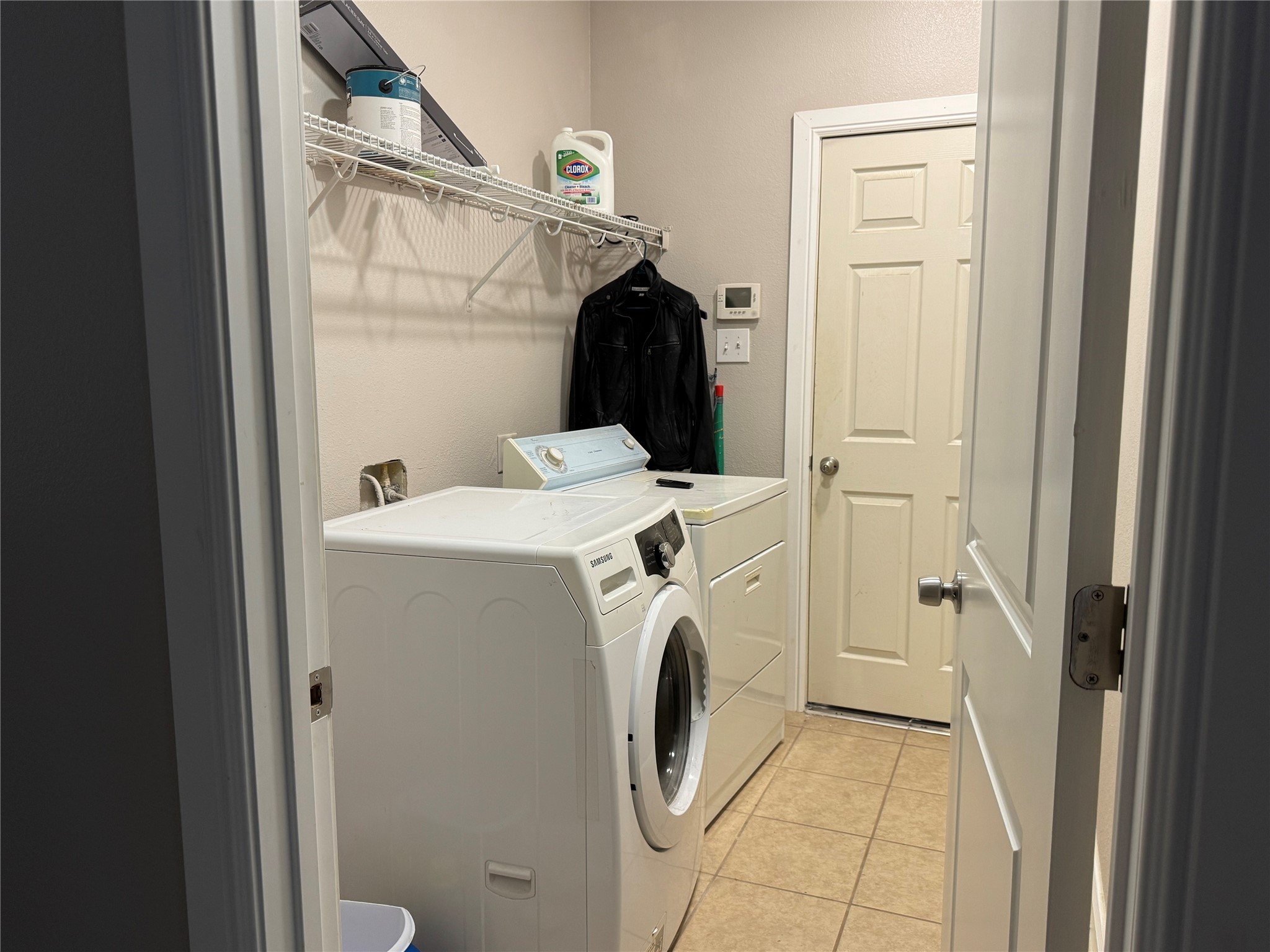 9431 Water Edge Point Lane Humble, TX 77396 - Photo 16 of 16 a utility room with dryer and washer