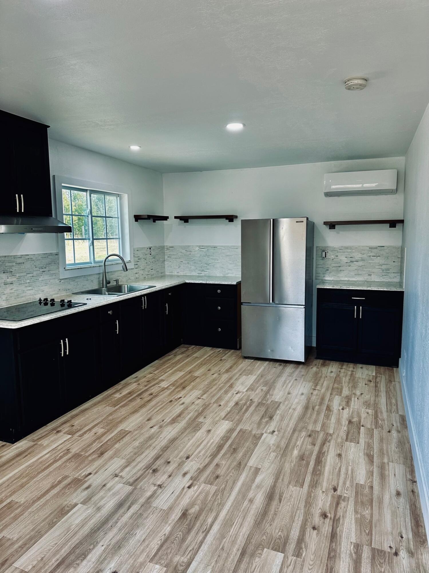 2514 Greensboro Road Washington, GA 30673 - Photo 7 of 36 including the refrigerator with cooktop stove