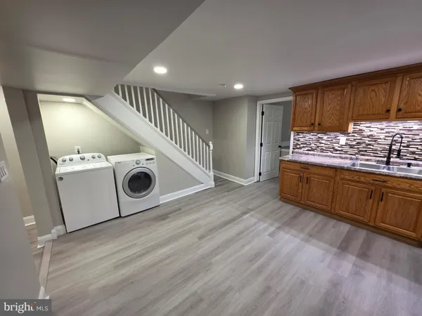 a kitchen with a stove and a refrigerator
