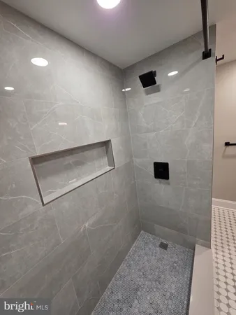 a bathroom with a sink vanity and mirror