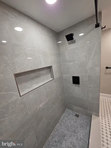 a bathroom with a sink vanity and mirror