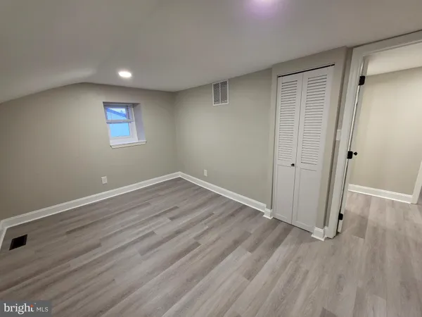 an entryway with wooden floor