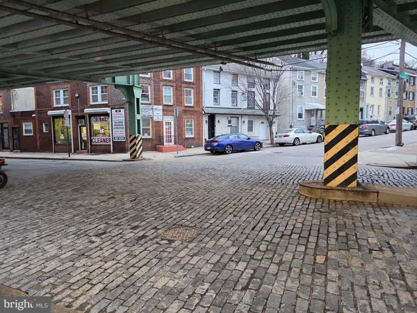 a front view of a house with parking space