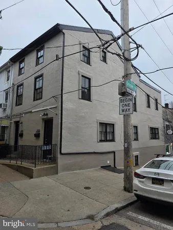 a view of a car parked in front of a house