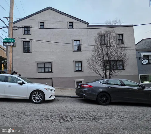 a view of a car parked in front of a building