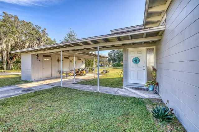 a bedroom with furniture and a large window