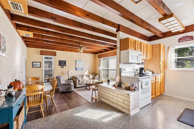 a view of a room with lots of furniture and clothes