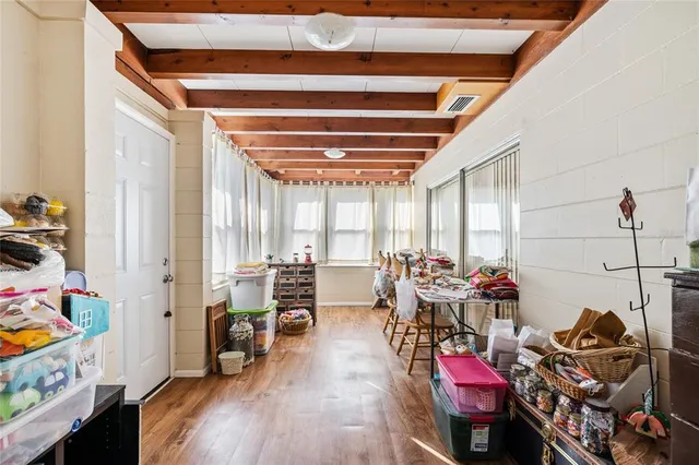 a bedroom with a bed and a book shelf