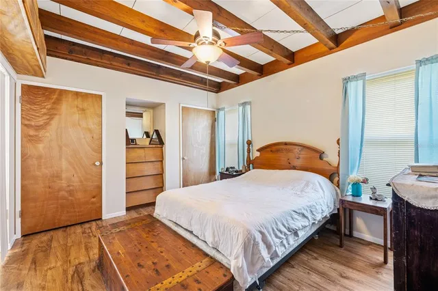 a bedroom with a bed and a dresser