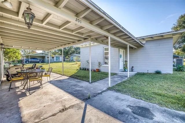 a view of a back yard of a house