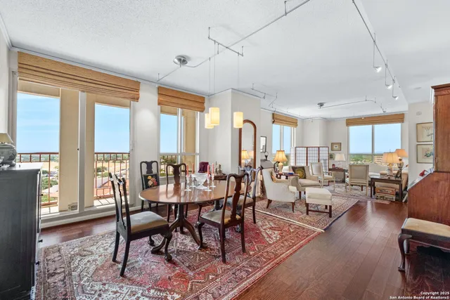 a view of a dining room with furniture window and wooden floor