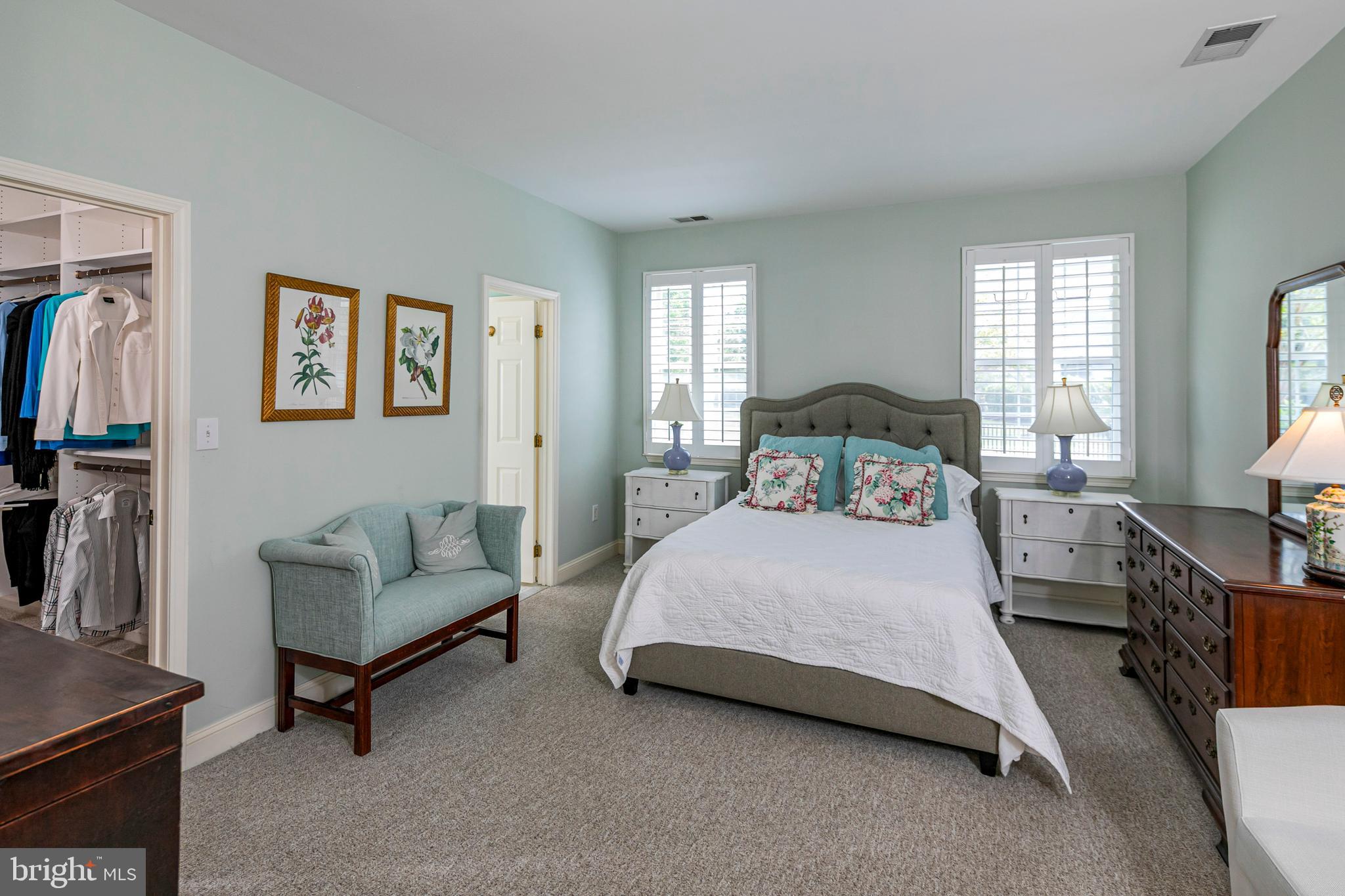 24 Foster Road Pennington, NJ 08534 - Photo 16 of 38 a bedroom with a bed a couch and a flat tv screen next to a window