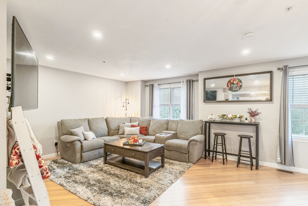 1975 Middlesex Street, Unit 2 Lowell, MA 01851 - Photo 11 of 31 a living room with furniture and a rug
