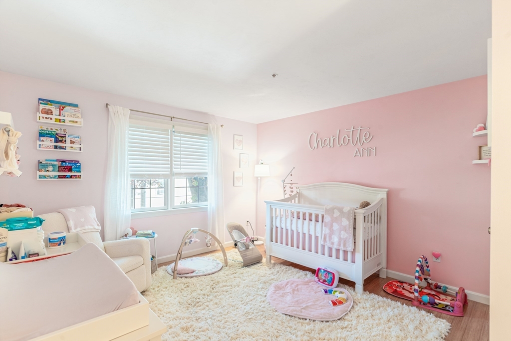 1975 Middlesex Street, Unit 2 Lowell, MA 01851 - Photo 14 of 31 a bedroom with furniture and a window