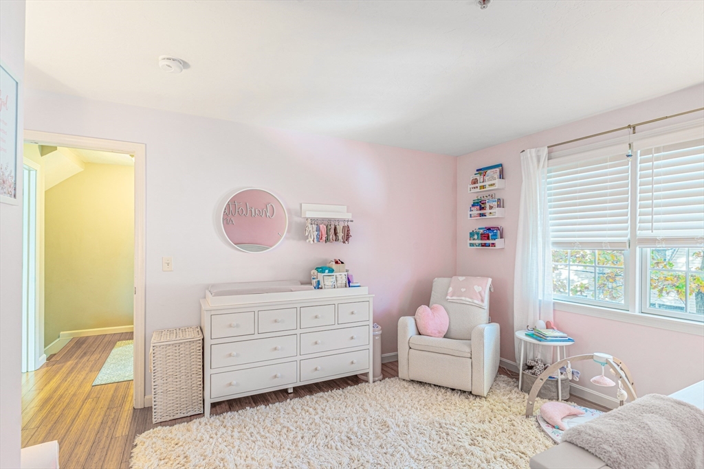 1975 Middlesex Street, Unit 2 Lowell, MA 01851 - Photo 16 of 31 a bedroom with a bed and a window