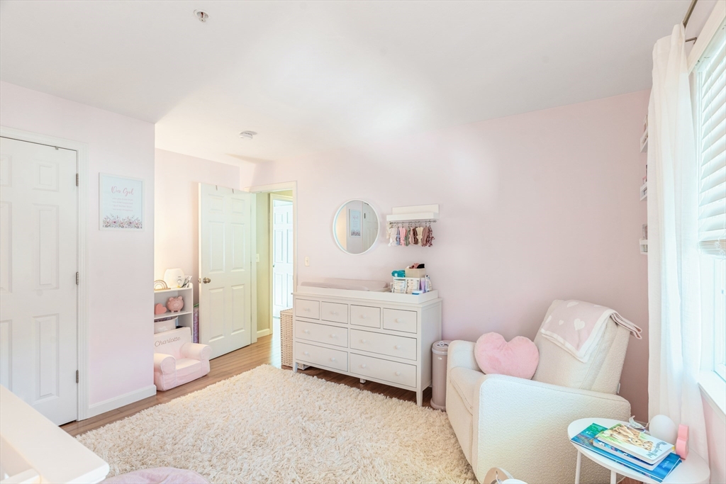 1975 Middlesex Street, Unit 2 Lowell, MA 01851 - Photo 18 of 31 a bedroom with furniture and a couch