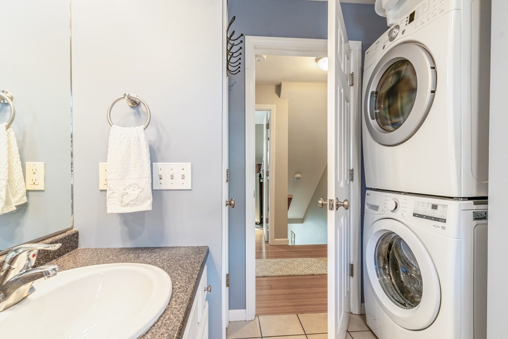 1975 Middlesex Street, Unit 2 Lowell, MA 01851 - Photo 21 of 31 a bathroom with a sink mirror and toilet