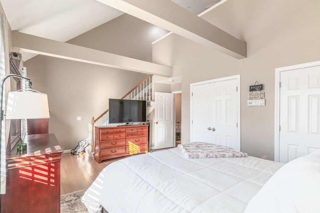 1975 Middlesex Street, Unit 2 Lowell, MA 01851 - Photo 24 of 31 a bedroom with a bed and a flat screen tv