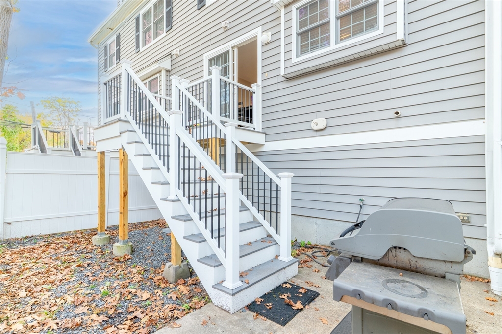 1975 Middlesex Street, Unit 2 Lowell, MA 01851 - Photo 30 of 31 a view of a house with wooden deck