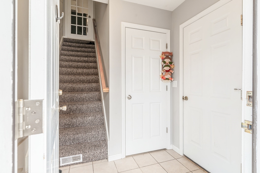 1975 Middlesex Street, Unit 2 Lowell, MA 01851 - Photo 4 of 31 a view of a hallway with windows and entryway
