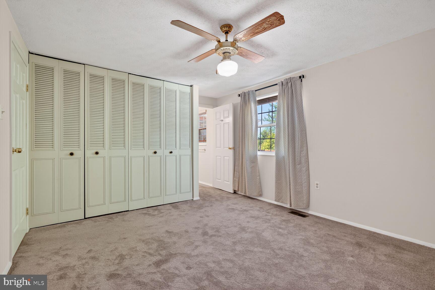2806 Logway Road Vienna, VA 22181 - Photo 13 of 33 a view of an empty room with a ceiling fan
