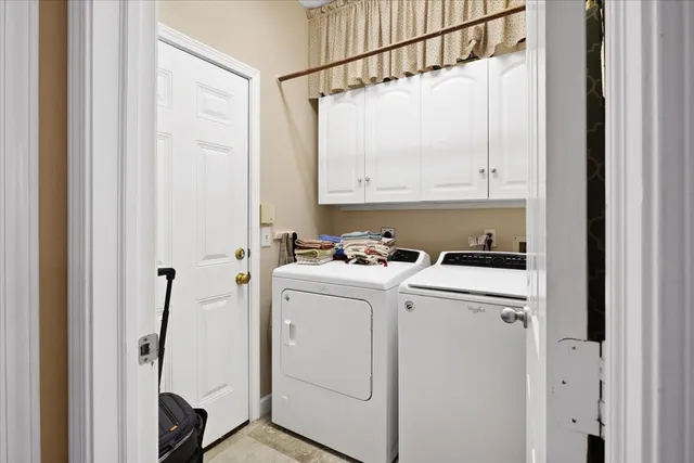 a view of bathroom with washer and dryer