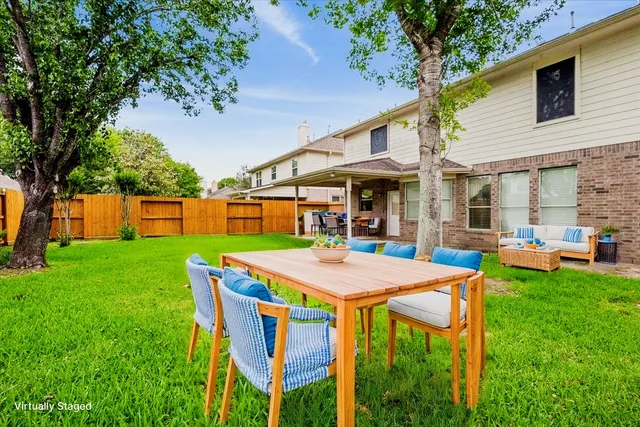 a view of yard with patio