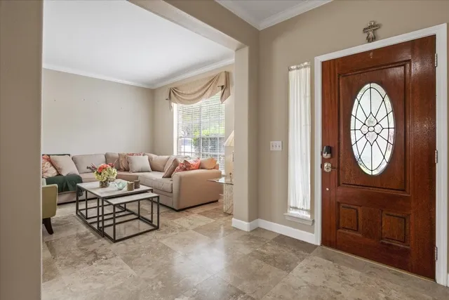 a living room with furniture a window and a closet