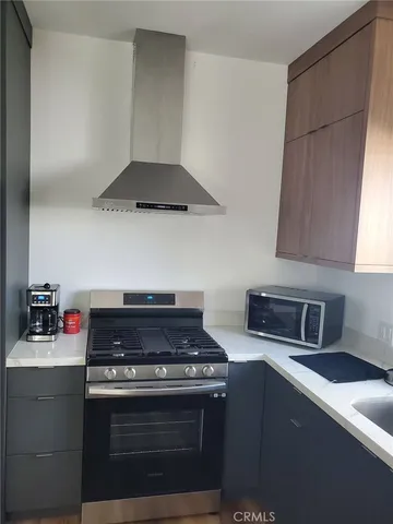 a kitchen with a stove and a cabinets