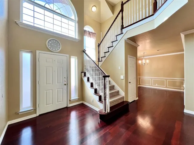 a view of an entryway with wooden floor